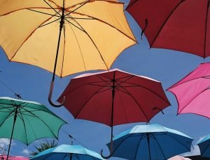 Colorful umbrellas symbolizing innovative solutions and creative problem-solving hub at The Good Feat.